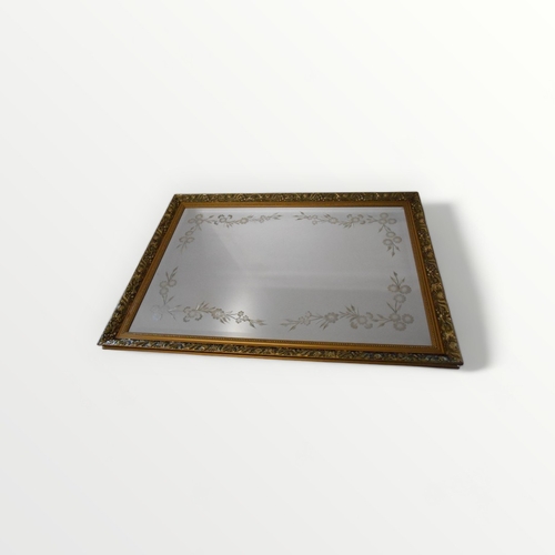 194 - Fancy gilt framed mirror having reverse glass etched floral swags. 71 x 102cm