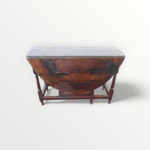 208 - 18th century oak twin flap drop leaf table, on canon barrel turned legs with single gateleg action. ... 