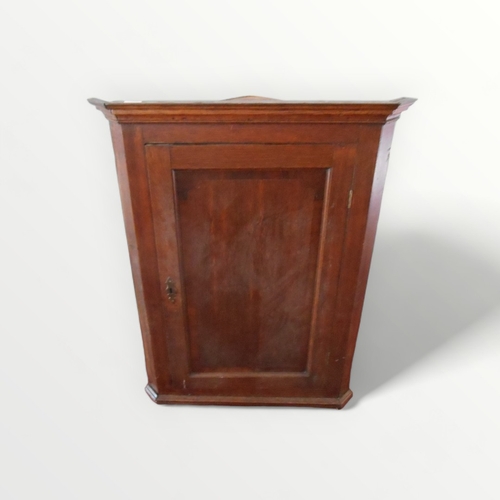 266 - Georgian oak hanging corner cupboard having plain front and three shaped interior shelves. 100 x 75c... 