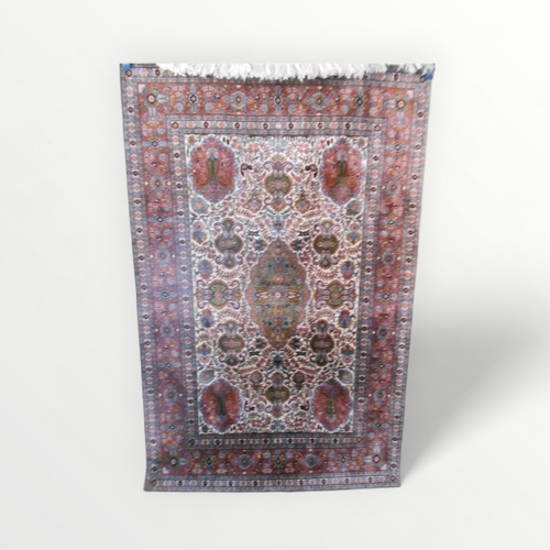 276 - A fine knotted silk rug having stylised floral central field within multi guard boarders. 121 x  184... 