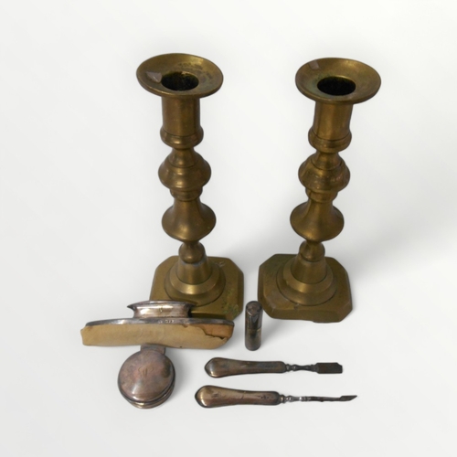 79 - A pair of Victorian brass candlesticks together with silver vanity case items.