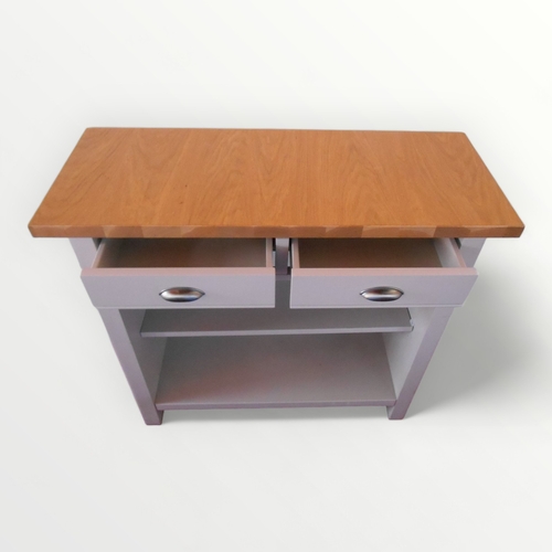 286 - Plain oak topped 'French grey' side unit with two drawers over open front shelved base. 85 x 90 x 35... 