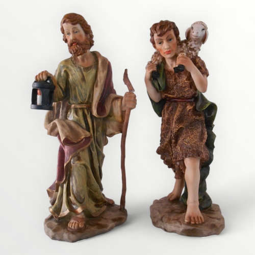 295 - Two cast and painted male figures on naturalistic bases. 50cm tallest. Shipping group (A).