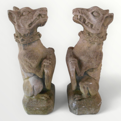 314 - Two large cast concrete 'Guardian Gargoyles' each seated on a plinth base and holding shields. 77cm ... 