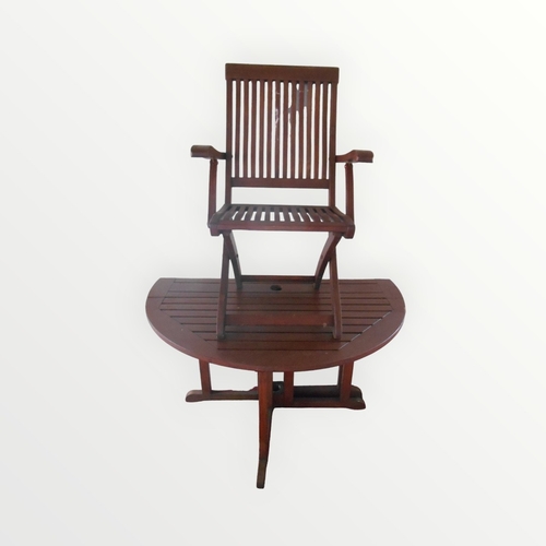 316 - Slatted teak five piece garden suite having folding circular table 77 x 119cm and four folding armch... 