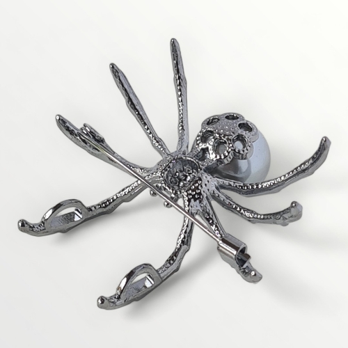 11 - A large gunmetal spider brooch, approx 4cm. Shipping group (A)