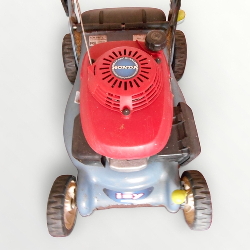 312 - A Honda powered petrol driven circular cutting lawn mower.