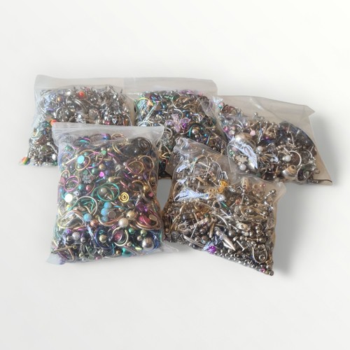 68 - Five bags of jewellery to include some silver. Total weight 566g. Shipping group (A).