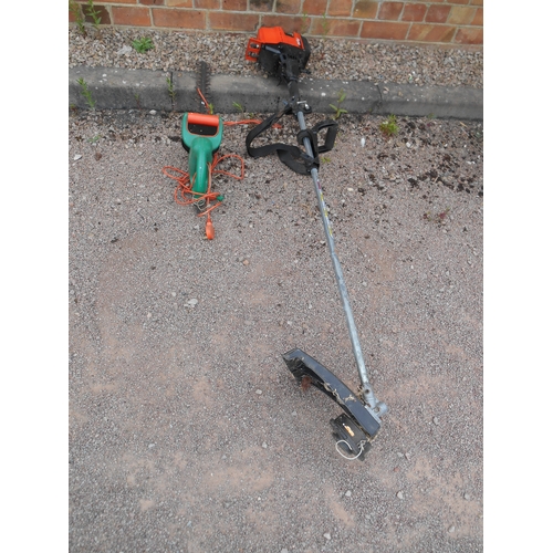 331 - A Flymo petrol powered strimmer and a 240v electric hedge cutter.