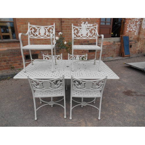 337 - Good quality painted cast metal garden suite - a large pierced table and six chairs.