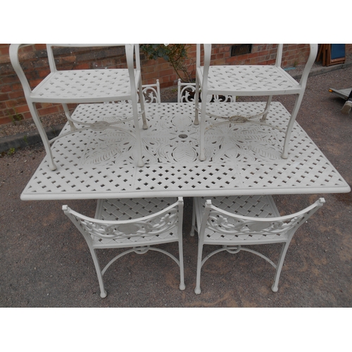 337 - Good quality painted cast metal garden suite - a large pierced table and six chairs.