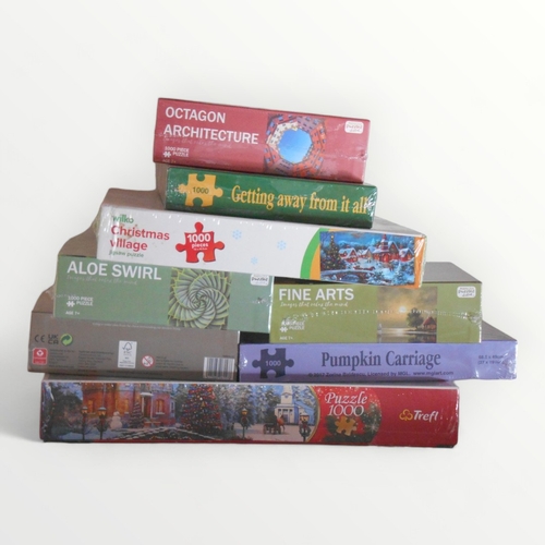 81 - Eight new and unused boxed jigsaws. Shipping group (A).