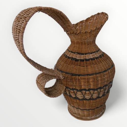 157 - Decorative woven rattan oversized jug, 49cm high.