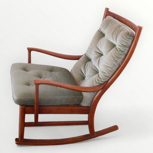 215 - Parker Knoll wooden rocking armchair with buttoned back and seat pads. 49cm to seat 92cm overall.