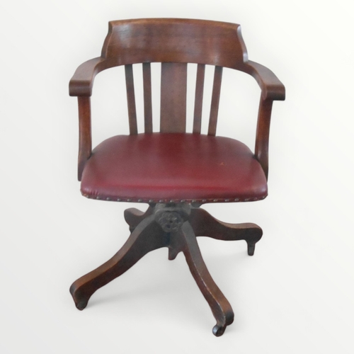 217 - 1930's English oak framed desk chair having horse shoe back with a pad seat on a sprung column and f... 