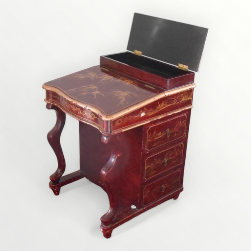 218 - Unusual lacquer finished davenport of typical form and construction having three side drawers opposi... 