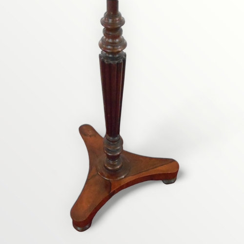 221 - Regency rosewood pole screen having a cast 'pineapple' finial, reeded column on a tri-form plinth wi... 