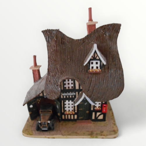 109 - Novelty pottery 'Country Cottage' table lamp, 27cm high.