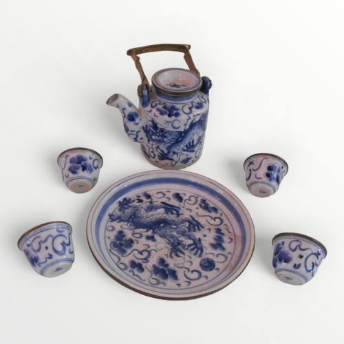 109A - Oriental Blue and white six piece tea set having metal rims, character marks to underside, 11cm high... 