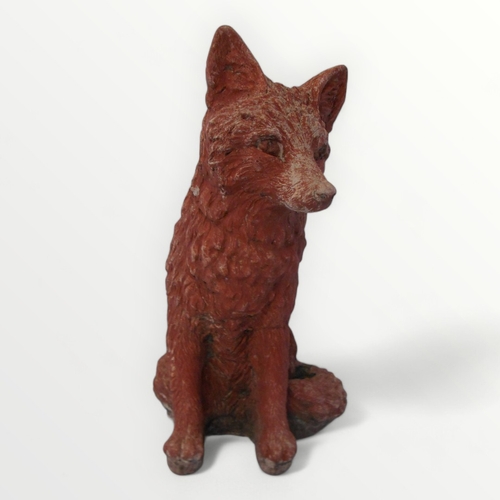 269 - Painted cast concrete model seated fox. 32cm high.