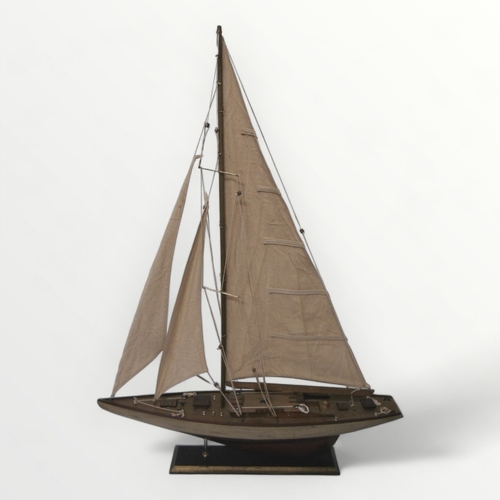 320A - Well made model yacht on plinth stand, 75 x 100cm.