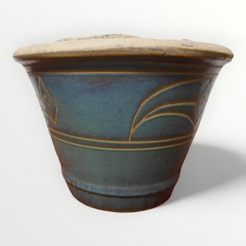 340 - Blue glazed tapering garden planter 39cm high and a ground standing bird bath 37cm diameter.