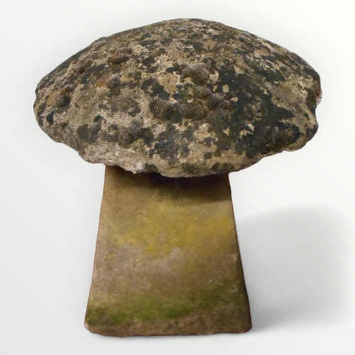 354 - Small decorative garden two piece staddle stone having well weathered mushroom top, 40cm high.