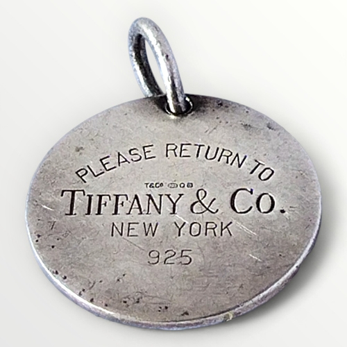 13 - Tiffany & Co., .925 silver tag pendant. 18g. Shipping group (A).