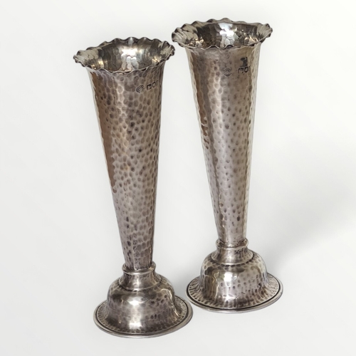 14 - A good pair of London hallmarked silver weighted trumpet vases, having fluted rim and hammered detai... 