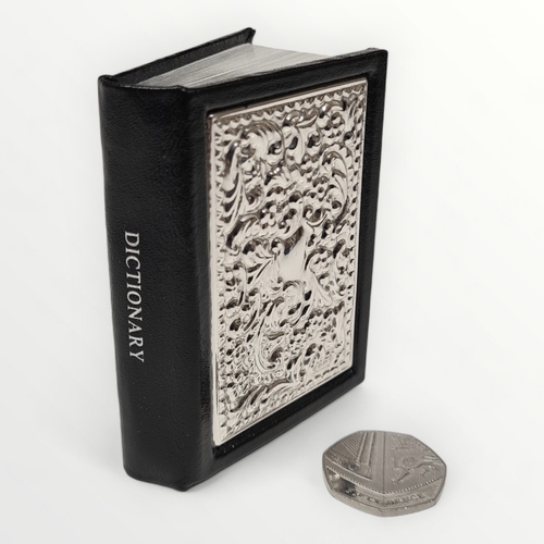 42 - Miniature English dictionary having sterling silver appliqué panel, hallmark for Sheffield. Shipping... 