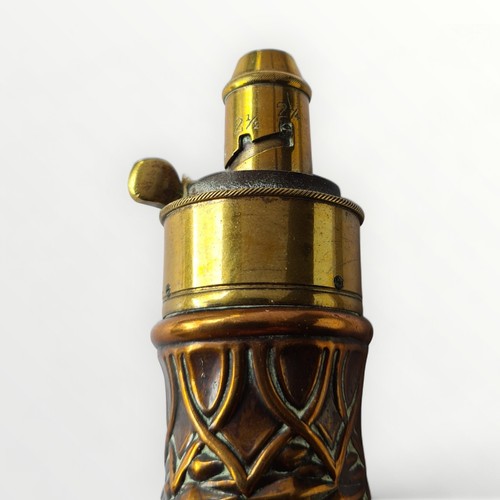 25 - Collectable lot comprising a large copper and brass powder flask measuring 21cm, together with a lea... 