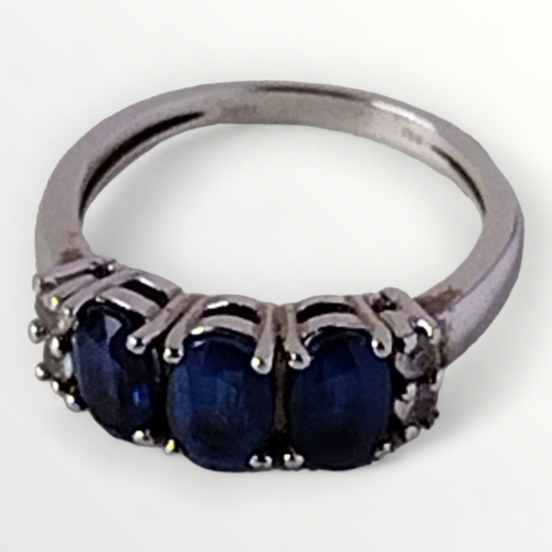 50 - .925 silver and blue stone set ring, size K. Shipping group (A).