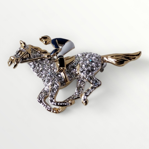 66 - Bejewelled jockey and horse brooch. Shipping group (A).