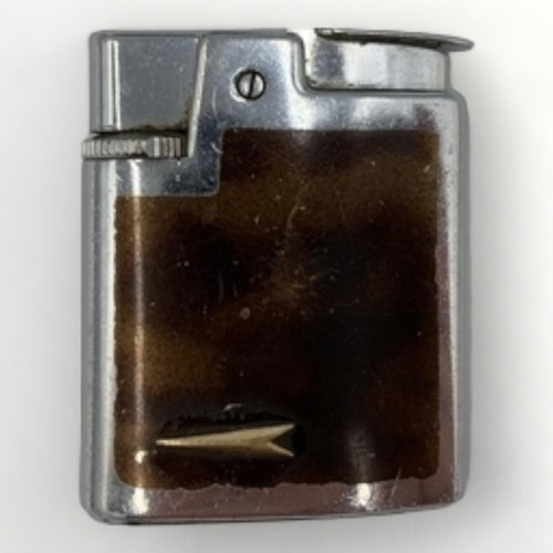 59 - Nine collectable vintage cigarette lighters; Ronson (8), Penguin (1). Shipping group (A).