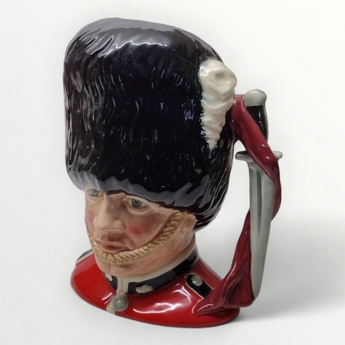 198 - Royal Doulton 'The Guardsman' D6755 character jug 20cm high. Shipping group (A).