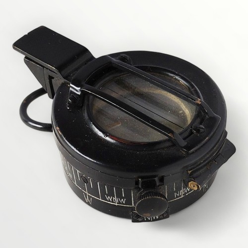 58 - An original WWII MKIII military compass, T.G. Co Ltd. London, carrying the broad arrow mark and numb... 