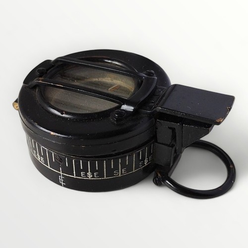 58 - An original WWII MKIII military compass, T.G. Co Ltd. London, carrying the broad arrow mark and numb... 