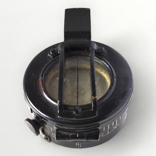 58 - An original WWII MKIII military compass, T.G. Co Ltd. London, carrying the broad arrow mark and numb... 