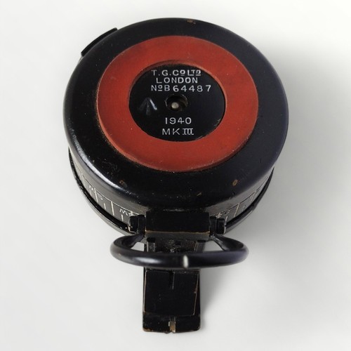 58 - An original WWII MKIII military compass, T.G. Co Ltd. London, carrying the broad arrow mark and numb... 