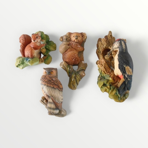 102 - Four hand painted plaster 'Bossons' wall mounting model animals. 30cm longest. Shipping group (B).