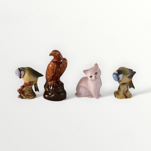 93 - Four model animals by Beswick, 10cm tallest. Shipping group (A).