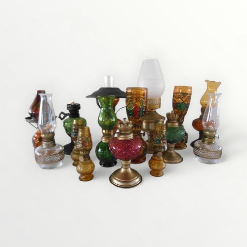 117 - Selection of coloured small sized glass oil lamps.