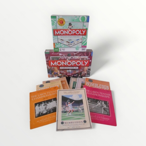 119 - Two as new boxed 'Monopoly' games and a selection of vintage Wimbledon Tennis programs. Shipping gro... 