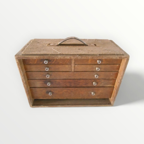 131 - 1950/60's oak engineers seven drawer tool chest with contents.