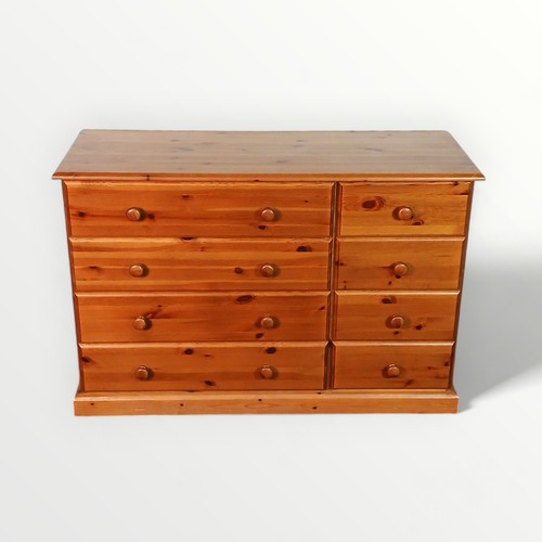 149 - Modern pine double width chest of eight drawers. 81 x 118 x 44cm.