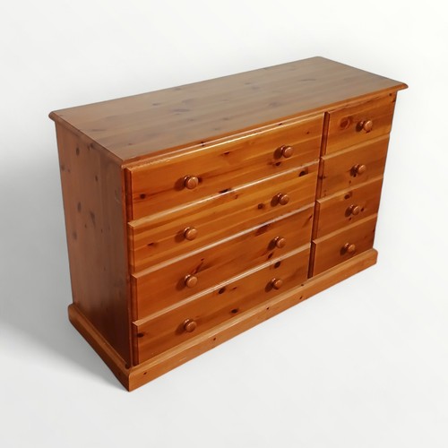 149 - Modern pine double width chest of eight drawers. 81 x 118 x 44cm.