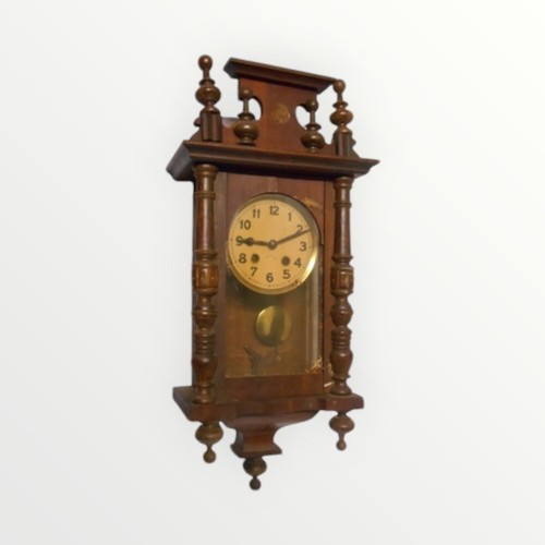 163 - A reproduction Viennese style hanging wall clock retaining pendulum and key. 64cm drop.