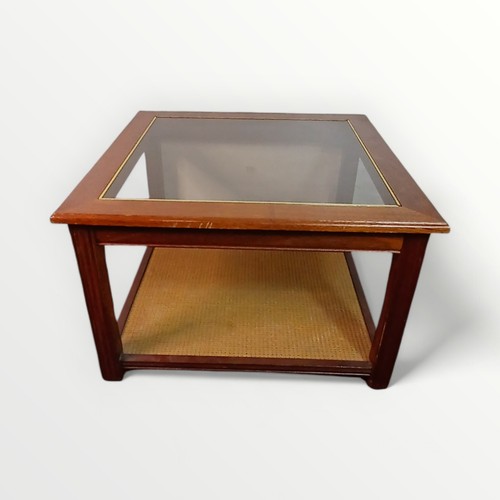 172 - Modern glass top coffee table with magazine under tier. 43 x 67cm.