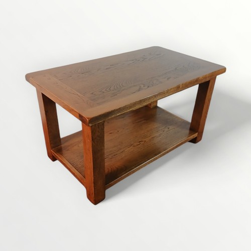 183 - Modern light oak coffee table with magazine undertier. 50 x 91 x 53cm.