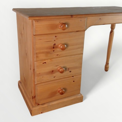 184 - Modern pine desk with a bank of four drawers, 72 x 105 x 44cm.